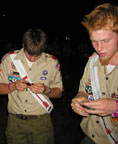 Two Arrowmen still working on piecing the Game Cube together.