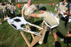 An Arrowman tipping a cow