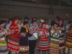 Dancers having their regalia judged by the panel