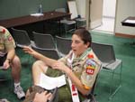 A young Arrowmen explains his idea to his group