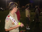 Arrowman Clutches a Tennis Ball, Prepared to pitch it during the Hodag