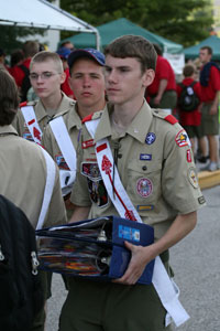 Arrowman with binders of patches